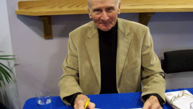 JOHN CAREY SIGNS: THE RELUCTANT PROFESSOR: (READING IS FREEDOM)