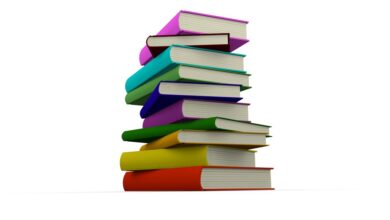 Colorful books stacked indie author sales milestone
