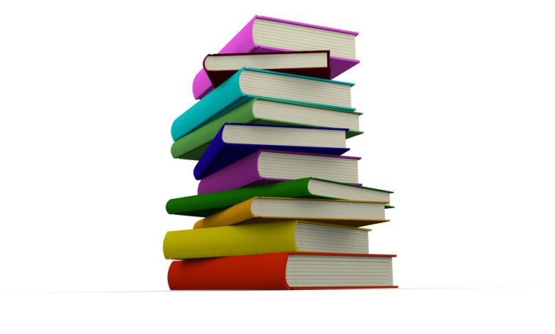 Colorful books stacked indie author sales milestone