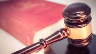 Legal gavel and law book copyright infringement lawsuit