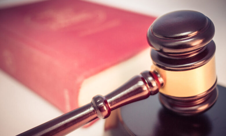 Legal gavel and law book copyright infringement lawsuit